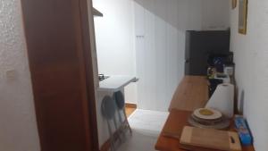 a small kitchen with a sink and a toilet at Le Gite Des Peyreyres in Lespéron