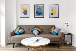 a living room with a couch and a table at Host & Stay - Bluebell Close in Northampton