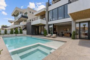an exterior view of a house with a swimming pool at Luxury Beachside home in St. George