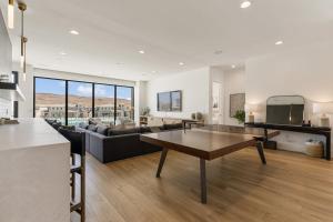 a living room with a couch and a table at Luxury Beachside home in St. George +98 photos