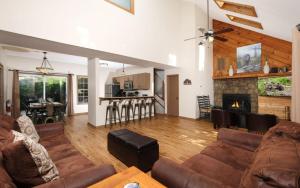 a living room with a couch and a fireplace at Coppertop View in Gatlinburg