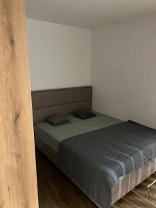 a bedroom with a bed in a room at Kasia in Budva