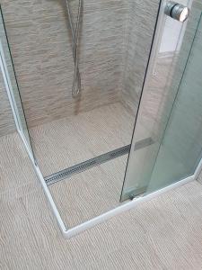 a shower with a glass door in a bathroom at Villa BS Sarajevo in Sarajevo +26 photos