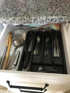 a drawer filled with utensils in a kitchen at Guesthouse Dolunay in Ayder Yaylasi +53 photos