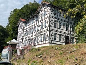 a large building on top of a hill at Rennsteighostel in Ruhla