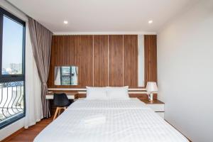 Katil atau katil-katil dalam bilik di Sumitomo Apartment - Linh Lang street