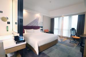 Letto o letti in una camera di Hampton by Hilton Guangzhou Zhujiang New Town - Free Shuttle Bus to Canton Fair