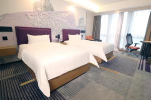 Letto o letti in una camera di Hampton by Hilton Guangzhou Zhujiang New Town - Free Shuttle Bus to Canton Fair