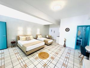 Ένα ή περισσότερα κρεβάτια σε δωμάτιο στο Arapiou Apartments