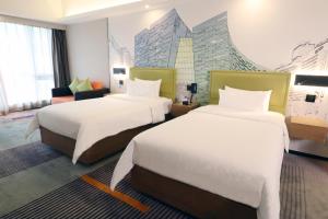 Letto o letti in una camera di Hampton by Hilton Guangzhou Zhujiang New Town - Free Shuttle Bus to Canton Fair