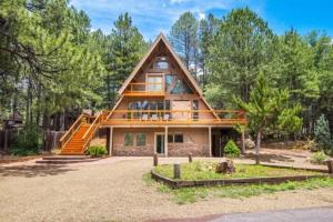 a large house with a gambrel roof at Woodland Chalet @ Kachina Village Deck Game Room w Ping Pong Poker Table in Mountainaire