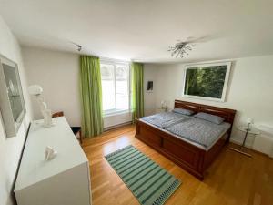 Postel nebo postele na pokoji v ubytování Fewo Isarblick Bad Tölz