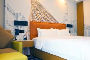 Letto o letti in una camera di Hampton by Hilton Guangzhou Zhujiang New Town - Free Shuttle Bus to Canton Fair