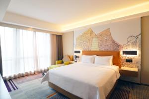 Letto o letti in una camera di Hampton by Hilton Guangzhou Zhujiang New Town - Free Shuttle Bus to Canton Fair