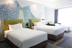 Letto o letti in una camera di Hampton by Hilton Guangzhou Zhujiang New Town - Free Shuttle Bus to Canton Fair