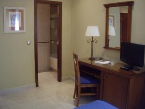 Telewizja i/lub zestaw kina domowego w obiekcie Hotel Manolo Mayo