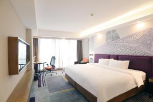 Letto o letti in una camera di Hampton by Hilton Guangzhou Zhujiang New Town - Free Shuttle Bus to Canton Fair