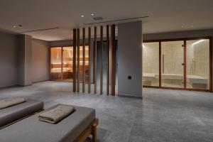 Voodi või voodid majutusasutuse Mosay All Suite Hotel toas