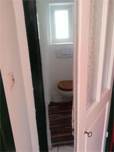 a bathroom with a toilet and a window at Haus Steinhof in Sankt Lorenzen ob Murau +36 photos
