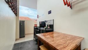 a kitchen with a counter top in a room at Tuwin Guest House Syariah in Yogyakarta