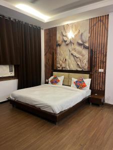 Ένα ή περισσότερα κρεβάτια σε δωμάτιο στο Hotel Rose Villa