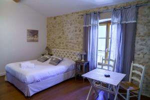 Katil atau katil-katil dalam bilik di Le Relais De Pigasse