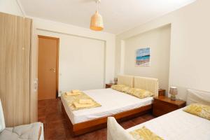 Voodi või voodid majutusasutuse Villa Sourouko toas +37 fotot