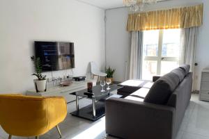 a living room with a couch and a table at Swieqi Stay with Shared Facilities 107 in Is-Swieqi