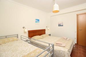 Letto o letti in una camera di Villa Sourouko