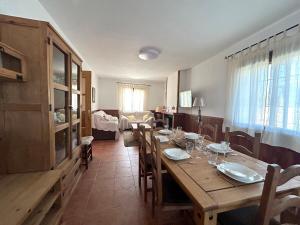 a dining room with a wooden table and chairs at Casa rural Juan Pablo in Segura de la Sierra