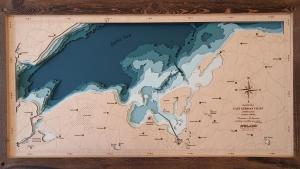 a map of the world in a wooden frame at Huk's 5 - Aurora Vista - ABC580 - nur Feriengäste! in Hohen Wieschendorf