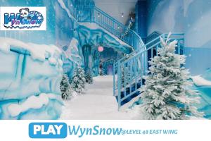 a fake snow covered staircase with a christmas tree at Wyndham Suites KLCC in Kuala Lumpur +53 photos
