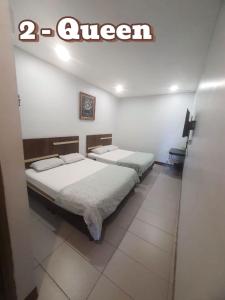 Postel nebo postele na pokoji v ubytování Ap Classic Hotel