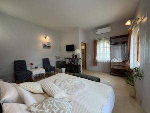 Postel nebo postele na pokoji v ubytování Pundin Khaoyai