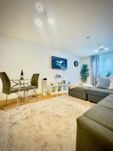 a living room with a couch and a table at Luxury 1 Bed Tower Bridge in London