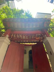 a building with a red roof on top of it at La Maison d'art de Hanoi in Hanoi