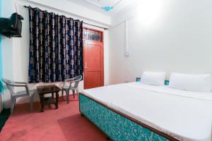 Rúm í herbergi á hotel dp bar and restaurent