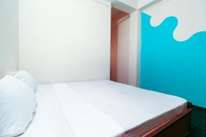 Rúm í herbergi á hotel dp bar and restaurent
