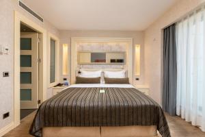 a bedroom with a large bed in a room at Limak Eurasia Luxury Hotel in Istanbul