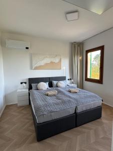 a bedroom with a large bed in a room at Casa Cabini Piave in Eraclea +54 photos