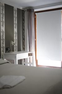 Postel nebo postele na pokoji v ubytování La Maison Jaune