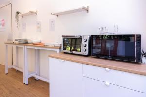 Kuchyň nebo kuchyňský kout v ubytování CiaoMi - Hostel & Long Stay - Milano Niguarda & Bicocca