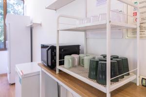 Kuchyň nebo kuchyňský kout v ubytování CiaoMi - Hostel & Long Stay - Milano Niguarda & Bicocca