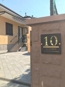 a sign for a building with the number on it at R&B MiDora Montale in Montale