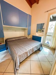 Postel nebo postele na pokoji v ubytování Airone Bianco Residence Village