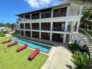 an aerial view of a building with a swimming pool at Marshmallow Bay Boutique Hotel & Surf Point Adults Only in Ahangama