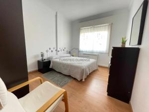 Łóżko lub łóżka w pokoju w obiekcie O cuarto de abastos