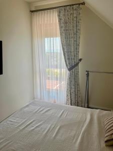 A bed or beds in a room at Panorama Vine House