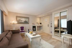 a living room with a couch and a table at Limak Eurasia Luxury Hotel in Istanbul