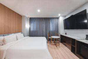 Hotel Palace Gyeongju客房内的一张或多张床位